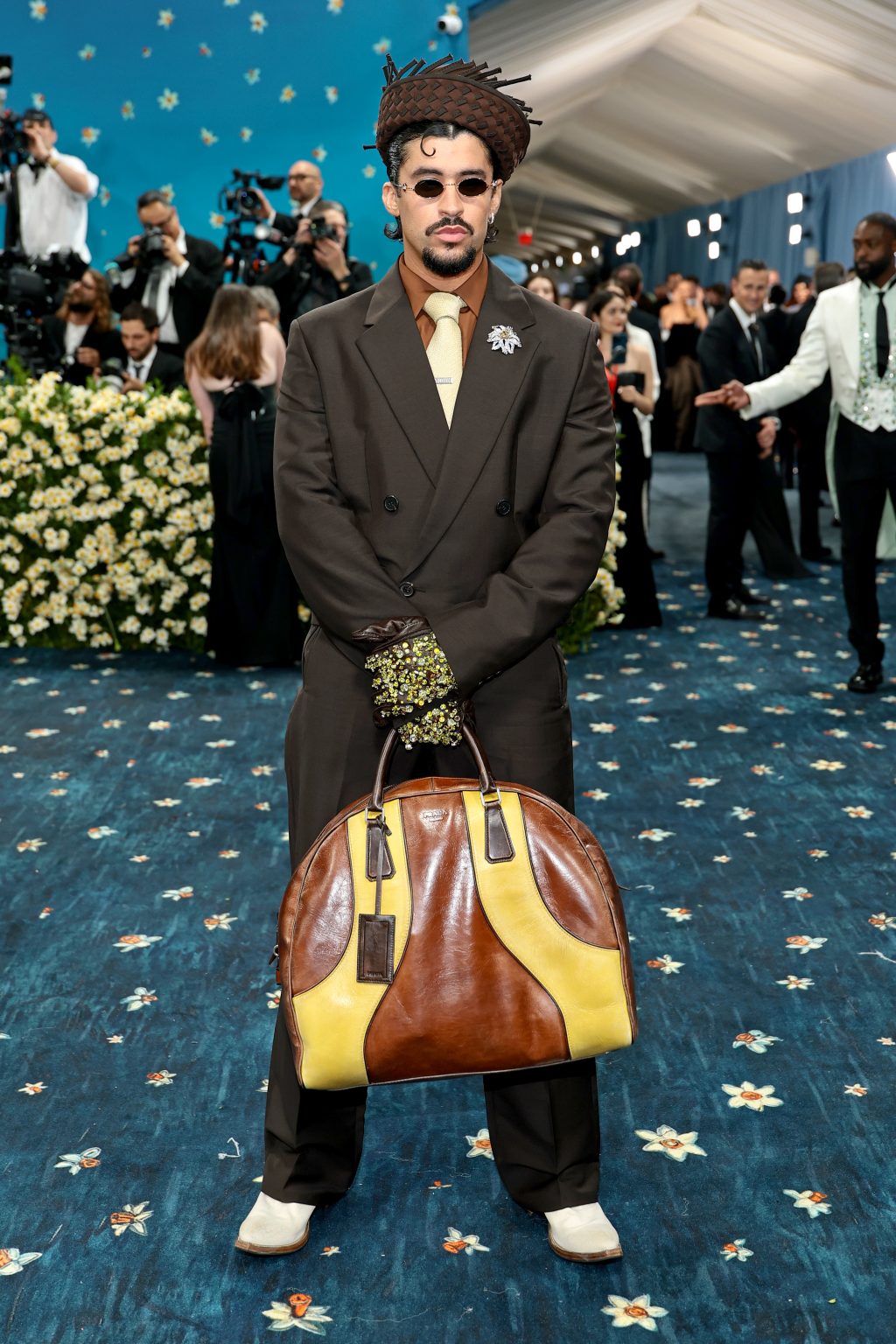 Bad Bunny showcasing his custom Prada ensemble on the Met Gala red carpet